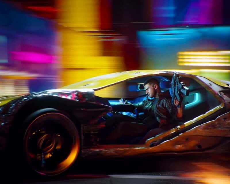 Cyberpunk 2077 samochod oraz bohater z bronią