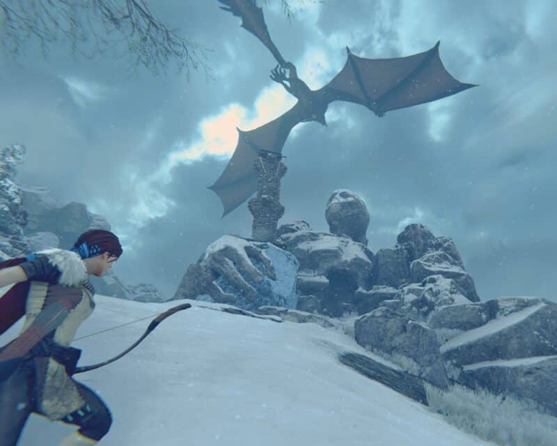 bohaterka w krainie skutej lodem, w tle na niebie smok