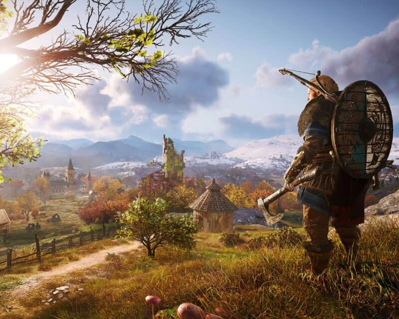 Assassin's Creed Valhalla patch 1.2.0 Eivor stojąca na progu miasta na górze i miasto w oddali