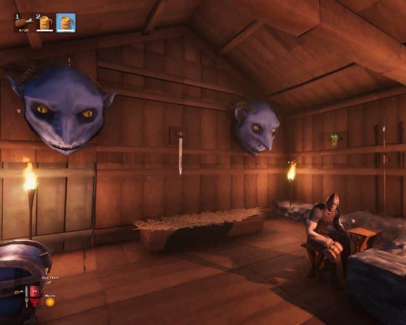 Valheim patch 0.147.3. - screen: postać siedząca w chatce, maski