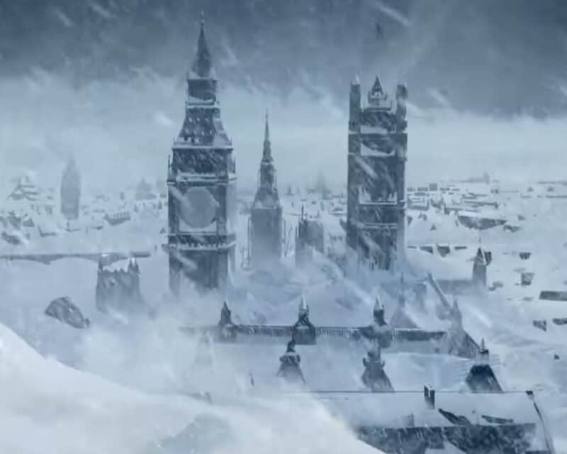 Frostpunk screen ze zwiastunu - ilustracja przedstawia wysokie budynki zasypane przez śnieg.