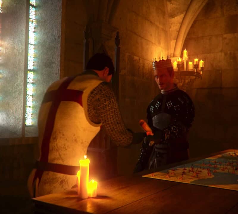 King's Orders zwiastun. Na obrazku Król wręcza rozkazy posłańcowi. Obok znajduje się stół z rozłożoną mapą.