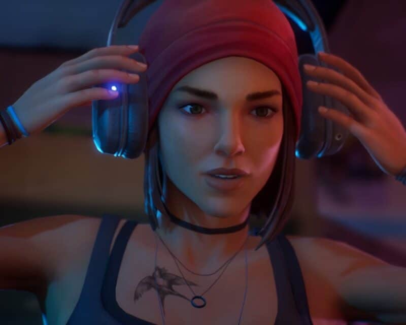 Life is Strange True Colors Wavelenghts premiera – screen z gry, Steph zdejmuje słuchawki, tatuaż, czapka
