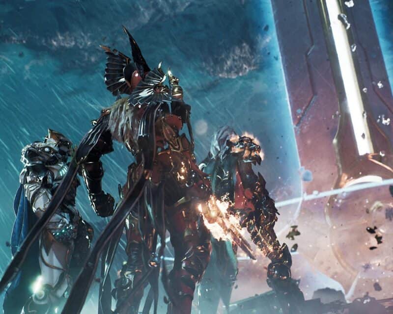 Godfall za darmo w Epic Games Store, a na obrazku bohaterowie w zbroi, tyłem do widza, patrzą w jakiś wielki kształt przed nimi, może to jakaś wieża