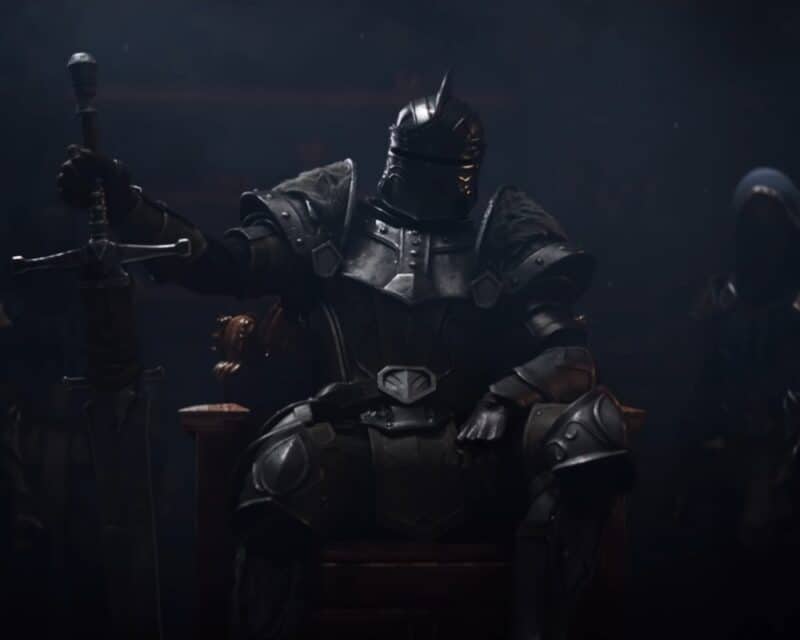 grafika ze zwiastuna promującego The Elder Scrolls Online: High Isle, od frontu przedstawiony jest na niej Lord Ascendant siedzący na krześle, za nim kilku z jego ludzi, The Elder Scrolls Online High Isle zapowiedź