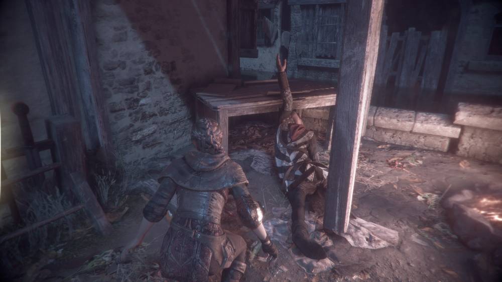 Screen z A Plague Tale: Innocence – Amicia z mężczyzną, którego zabiła