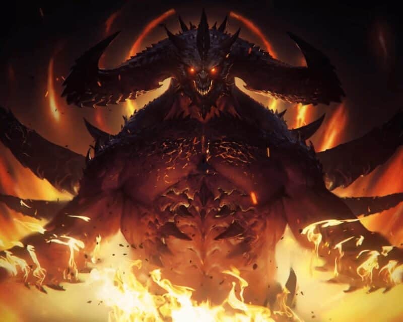 Ciemna sylwetka potwora z czerwonymi oczami, przypominająca demona w otoczeniu ognia, Diablo Immortal wymagania PC