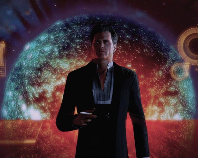 ME2: LE – mężczyzna w czarnym garniturze, z papierosem, patrzący w kamerę w swoim charakterystycznym gabinecie, na tle słońca Mgławicy Końskiego Łba, Mass Effect 2 Legendary Edition recenzja