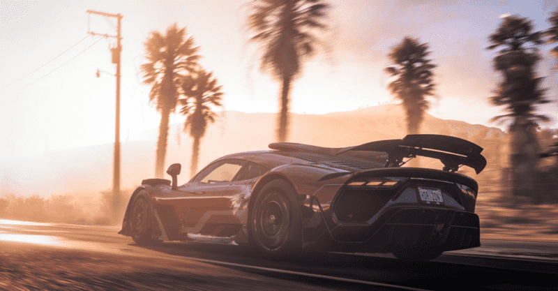 Recenzja gry Forza Horizon: kadr z produkcji. Na grafice znajduje się zamochód na tle palm i zachodzącego słońca.