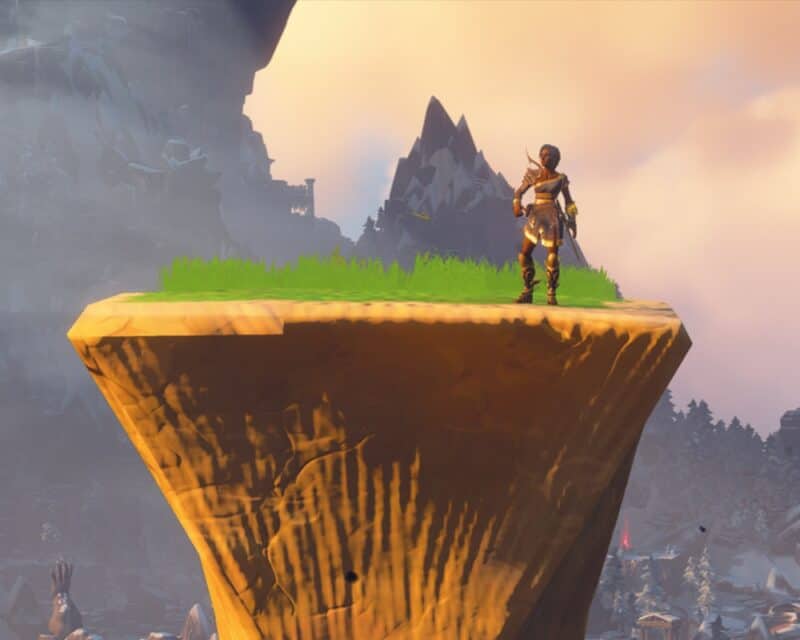 Immortals Fenyx Rising, zrzut ekranu – bohaterka stojąca na wysokiej skale, patrzy w dal – zapowiedź spin-offu o tytule Oxygen