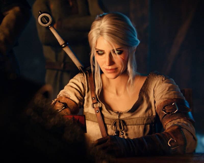 Ciri z Wiedźmina 3: Dziki Gon siedzi przy stole grając w karty