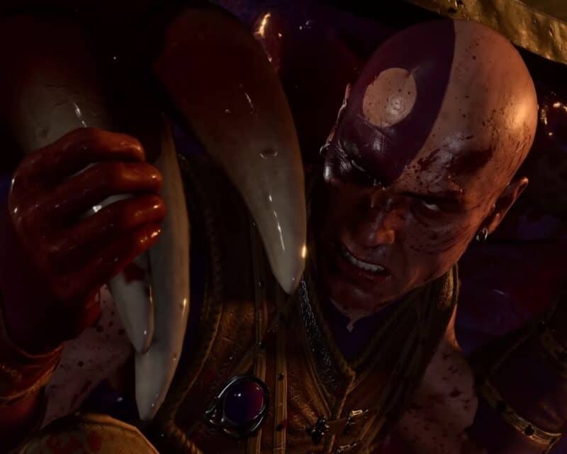 grafika z gry Baldur's Gate 3, pokazuje mężczyznę z fioletowymi barwami wojennymi na połowie twarzy i głowy, walczy z mimikiem (skrzynią-pułapką), widać jego kły, Baldur's Gate 3 zwiastun
