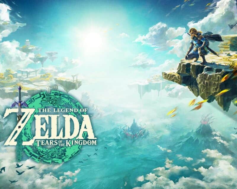 grafika przedstawia niebo, a na pierwszym planie napis The Legend of Zelda Tears of the Kingdom, w prawym górnym rogu na skalnym urwisku kuca chłopiec w blond włosach i niebieskim stroju