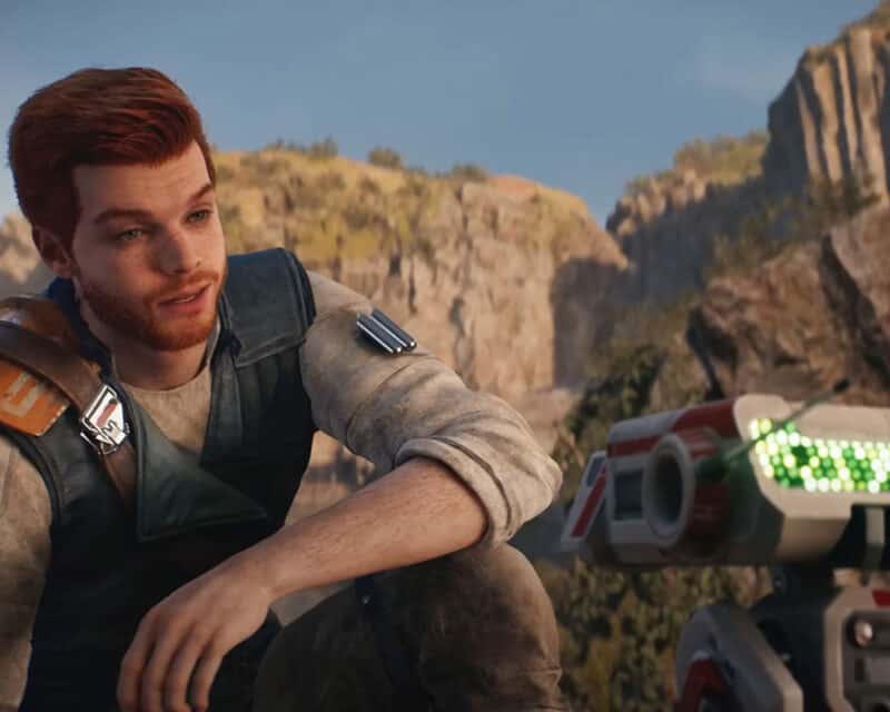 Obrazek przedstawia protagonistę gry Star Wars Jedi: Ocalały, Cala Kestisa. Mężczyzna kuca, aby móc spojrzeć na robota BD-1.