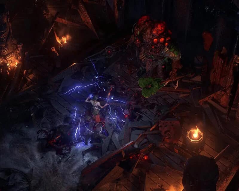 Grafika przedstawia bohaterkę Path of Exile 2, posługującą się elektrycznymi umiejętnościami. Naprzeciwko jej stoi boss dzierżący dwie bronie. Wokół nich leżą zwłoki pokonanych wrogów i ruiny zniszczonych budynków.