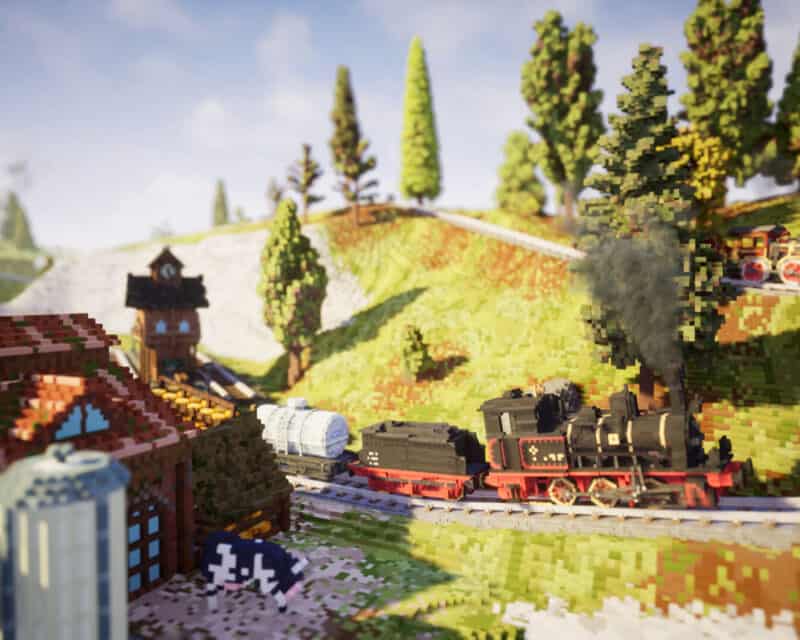 Obrazek przedstawia zrzut ekranu z gry Station to Station. Przez wiejskie otoczenie wiodą tory, po których jedzie pociąg. Wszystko utrzymane jest w grafice wokselowej.