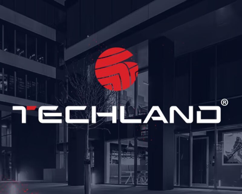 Techland przejęty przez Tencenta - plakat Techlandu, biały napis na szaroczarnym tle, czerwone logo nad napisem