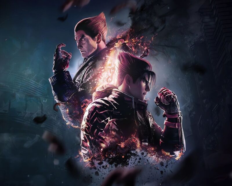 tekken 8 gamescom 2023 zwiastun data premiery, w centrum zdjęcia widać dwóch mężczyzn odwróconych do siebie plecami z krótkimi, ciemnymi włosami, ułożonymi w górę, jeden z mężczyzn, znajdujący się po lewej stronie zaciska pięść, zdjęcie jest w ciemnych odcieniach, jednak między postaciami znajduje się jasna przestrzeń w postaci łańcucha w ogniu, oddzielającego sylwetki dwóch mężczyzn