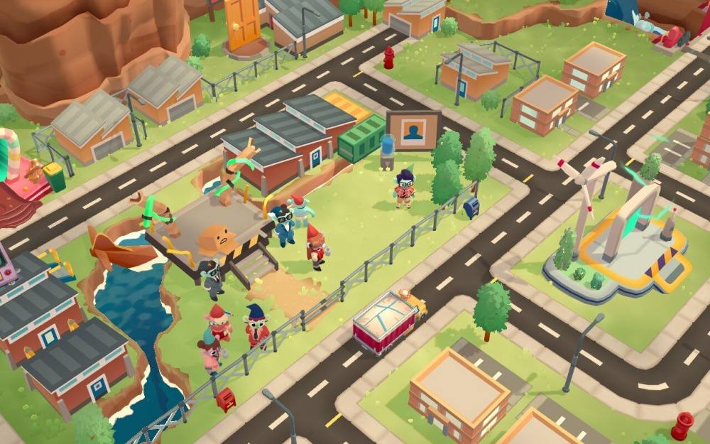 Screen z gry Moving Out 2. Obrazek przedstawia widok z góry na miasteczko. Widzimy m.in. domki, ulice, wiatrak i grupkę kolorowych bohaterów.