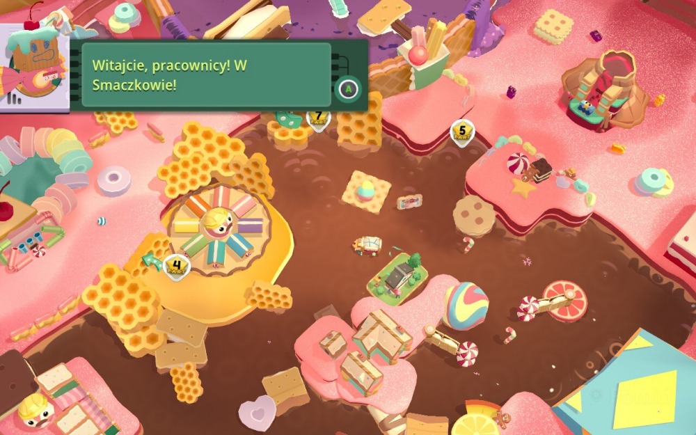 Screen z gry Moving Out 2. Obrazek przedstawia kolorową krainę pełną słodyczy – gofrów, ciastek, lizaków, plastrów miodu, chatek z piernika i innych słodkości.
