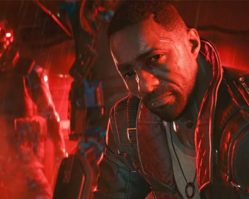 czarnoskóry mężczyzna w kurtce na czerwonym tle