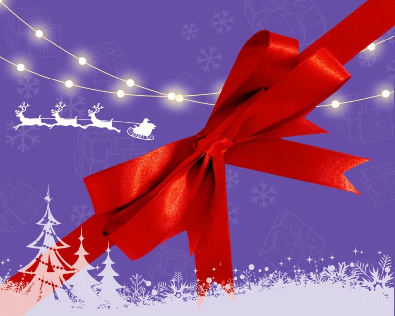 Grajmerki najlepsze prezenty dla graczki i gracza, na grafice fioletowe tło, na skroś czerwona kokarda, a na tle biała figura sań Mikolaja i reniferów oraz kontur lasu