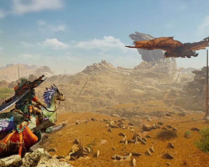 pustynia, na niebie widać latającego potwora, na skale stoi człowiek dosiadający ptaka