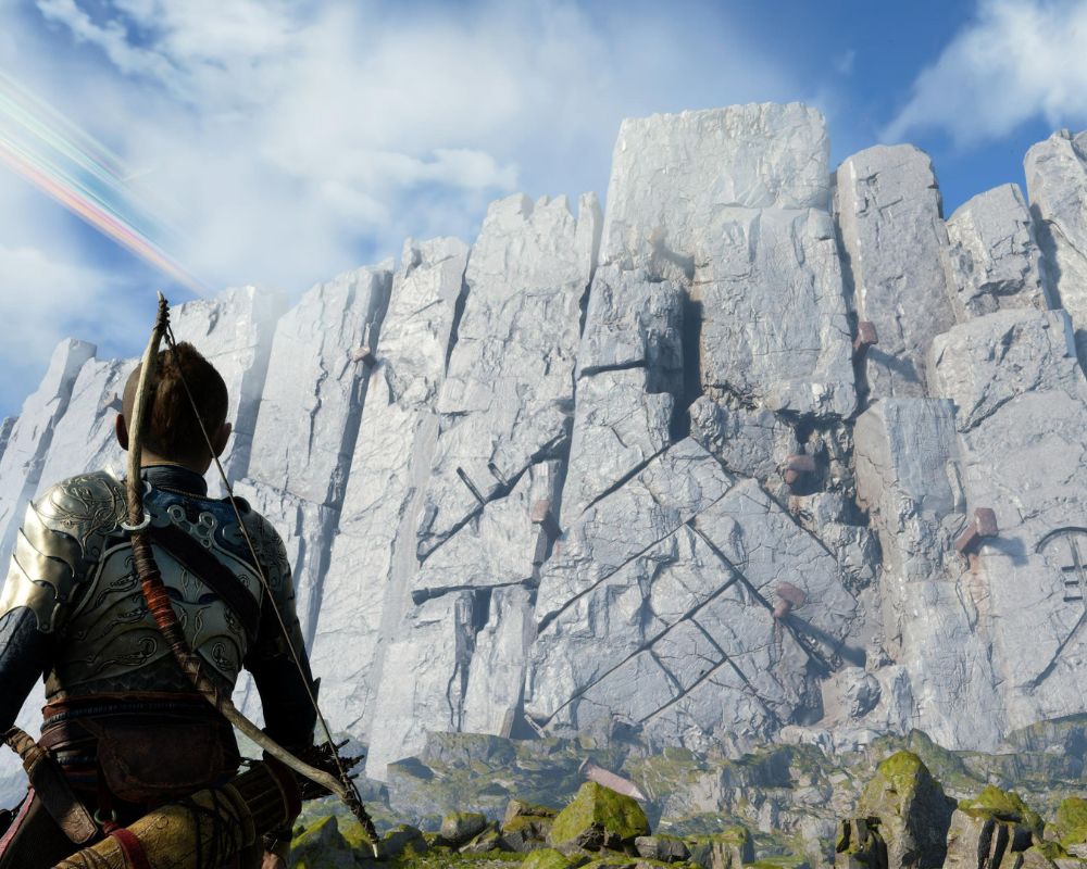 Atreus doi na przeciwko skalistej ściany