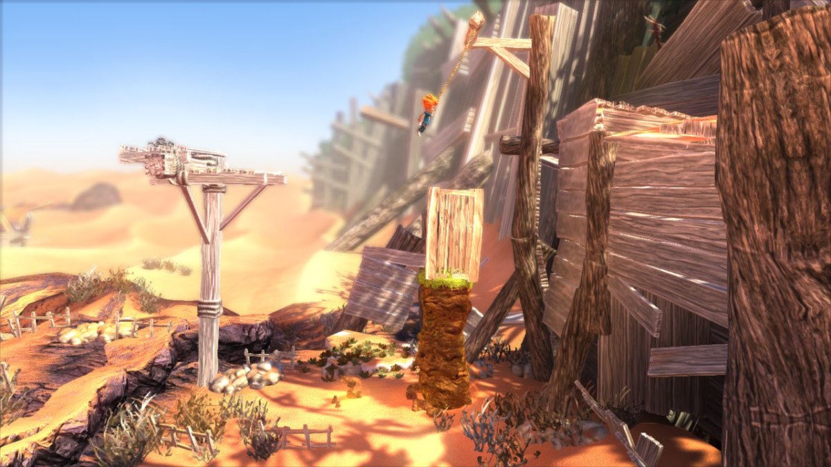 Screen z gry "Max: The Curse of Brotherhood", na obrazku widać chłopca wiszącego na linie, pod nim znajduje się skrzynia, po której wdrapał się na górę