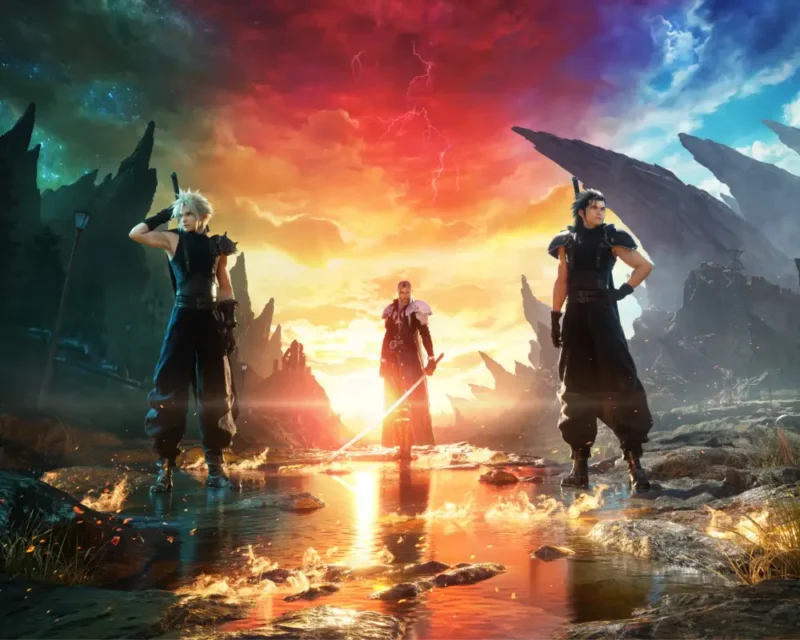 Na tym efektownym i symbolicznie naładowanym obrazie promocyjnym z gry FINAL FANTASY VII REBIRTH widzimy trzech kultowych bohaterów stojących na tle spektakularnego, niemal apokaliptycznego krajobrazu. Od lewej do prawej: Cloud Strife – z ikonicznym mieczem Buster Sword, w bojowej pozie, spogląda w dal, gotowy do walki. Sephiroth – centralna postać, stojąca w świetle zachodzącego (lub wschodzącego) słońca, z opuszczonym mieczem, co nadaje mu niemal boskiego lub złowrogiego charakteru. Zack Fair – z podobną posturą do Clouda, ale patrzący w przeciwnym kierunku, co może symbolizować jego odmienną drogę lub los. Sceneria jest niezwykle dramatyczna: poszarpane skały, odbijające się w wodzie niebo w kolorach czerwieni, pomarańczu i błękitu tworzą atmosferę napięcia i przeznaczenia. Całość obrazu oddaje motywy konfliktu, przeznaczenia i tożsamości, które są kluczowe dla fabuły REBIRTH.