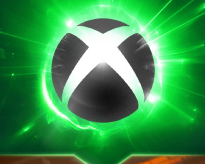Czarne logo firmy Xbox na zielonym świetlistym tle, firma rozważa otwarcie sklepu mobilnego