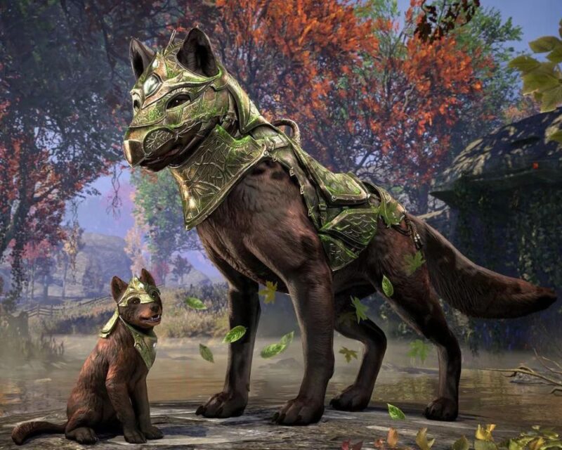 The Elder Scrolls Online Gold Road za darmo, na grafice widzimy dużego brązowego wilka w zielonej zbroi na pyszczku i grzbiecie, przed nim siedzi mały wilczek, w tle las
