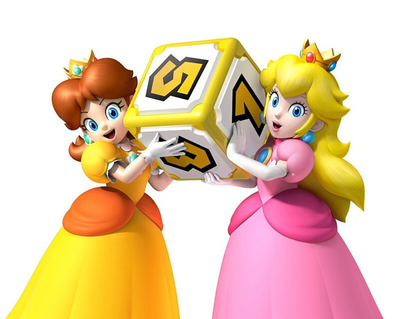 Obrazek przedstawia księżniczkę Peach i księżniczkę Daisy z serii Mario, trzymające dużą kostkę do gry w rękach.