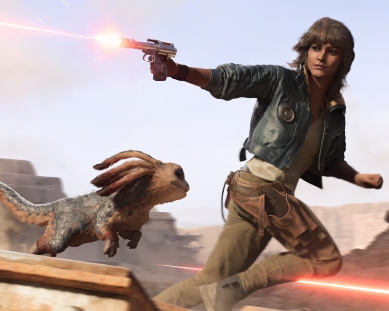 Zapowiedź Star Wars: Outlaws na Summer Game Fest 2024 – główna bohaterka, Kay Vess, w ruchu – odwraca się, strzelając z blastera, obok niej zwierzątko