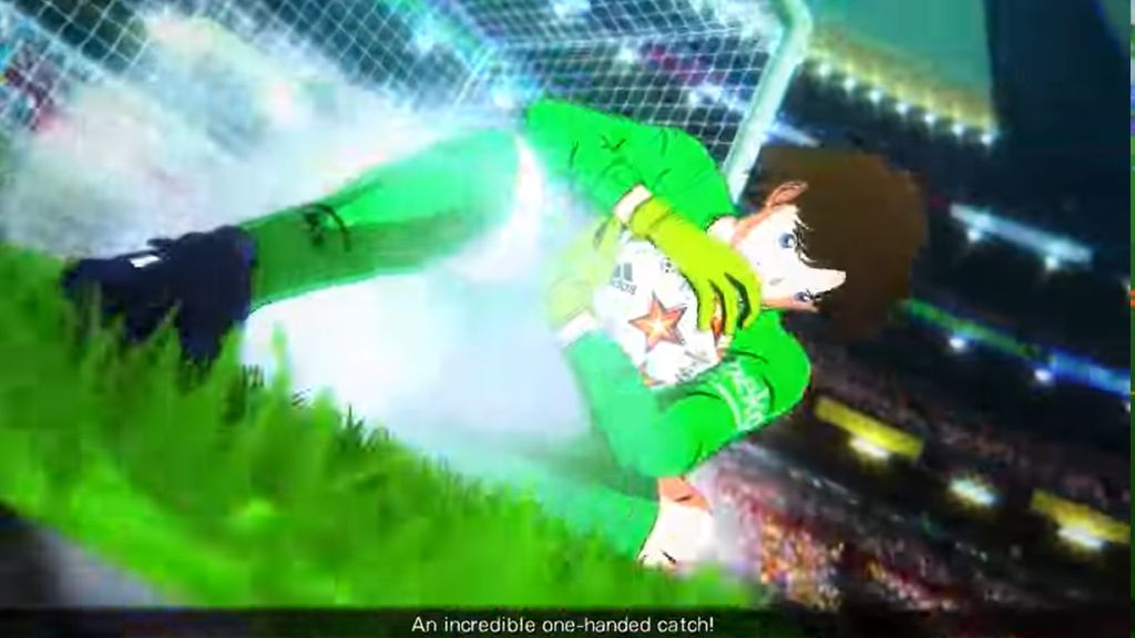 Bramkarz ledwo łapie piłkę.