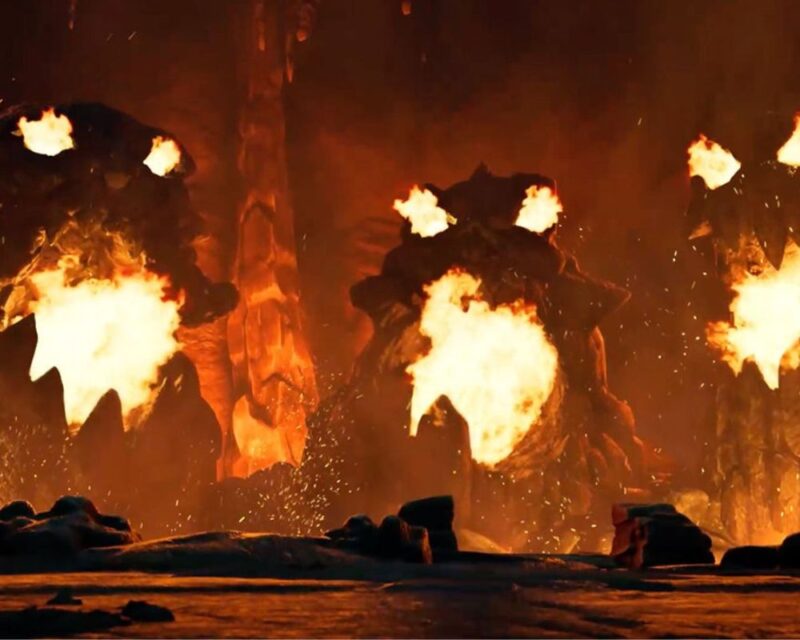 Trzy skalne głowy buchające ogniem