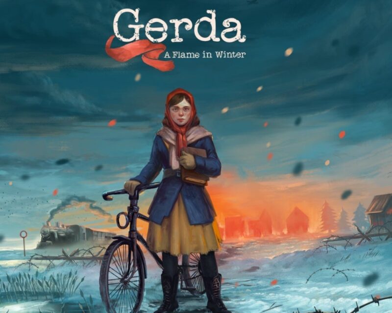 Kobieta w chuście stoi przy rowerze, trzyma książkę. W tle zima.