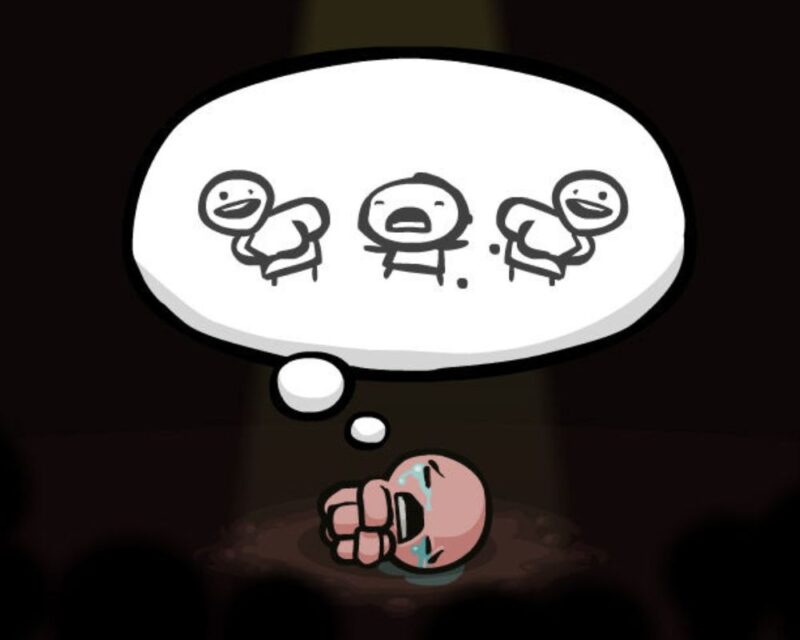 screenshot z gry The Binding of Isaac, widzimy czarne tło, na środku obrazka jest postac małego chłopca leżącego na ziemi w pozycji embrionalnej i płaczącego, nad nim unosi się dymek z rysunkami różnych min