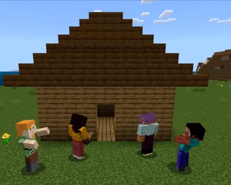 Postacie z Minecrafta stojące na łące przed drewnianym domkiem, wkrótce w grze pojawi się więcej bezpłatnych aktualizacji i port na PS5.