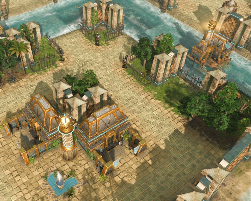 Na obrazku widać budynek, wokół niego brama, i woda przypominająca fosę.