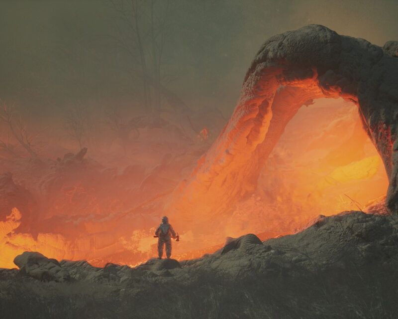 na środku obrazka widzimy mężczyznę stojącego u progu wąwozu rozświetlonego od płynącej przez niego lawy, cały obrazek utrzymany jest w odcieniach szarości i pomarańczu, zapowiedź gry Dante's Ring