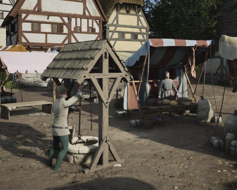 Na obrazku widać średniowieczne miasteczko z gry Manor Lords. W centralnym punkcie znajduje się nowość, czyli studnia.