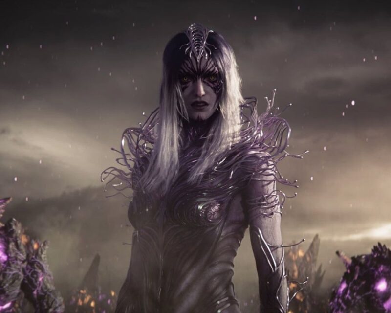 zapowiedź Solasta 2, widzimy kobietę-demona, o ciemnofioletowej skórze i długich blond wlosach, w tle zadymione szarobrunatne niebo