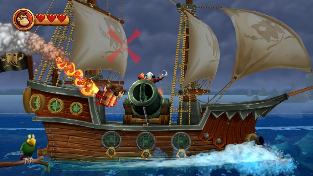 Donkey Kong sterujący latającą beczką. W tle statek piracki z armatą.