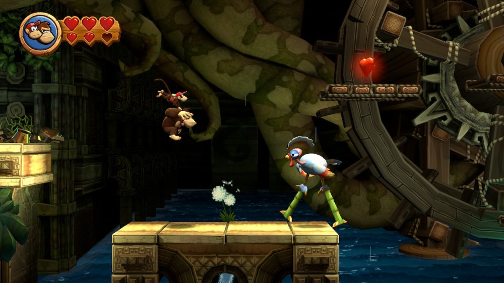 Widok z gry Donkey Kong – widzimy postacie Donkey Konga i Diddy'ego Konga doskakujących do postaci przypominającej ptaka chodzącego na tyczkach.