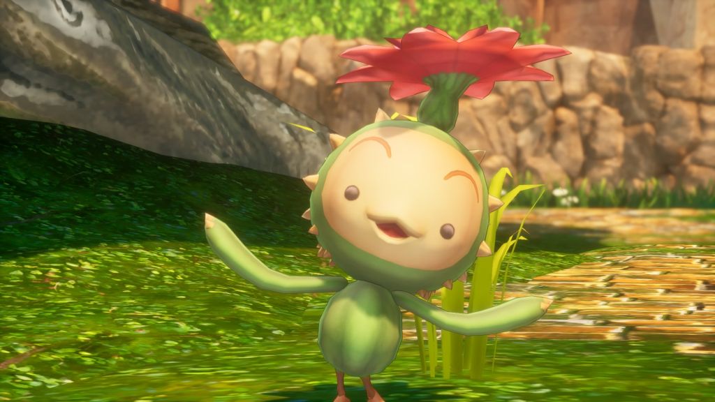 Mały kaktus z kwiatkiem na głowie. Uśmiecha się i tańczy.