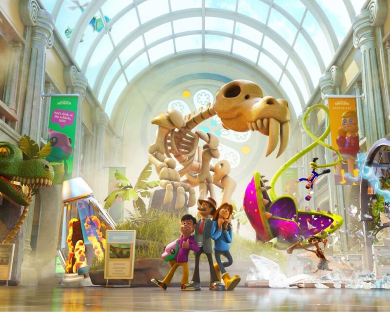 Obrazek ukazuje pełne życia muzeum z ogromnym szkieletem prehistorycznego zwierzęcia, interaktywnymi eksponatami i egzotycznymi roślinami. Zwiedzający z zaciekawieniem odkrywają kolejne atrakcje.