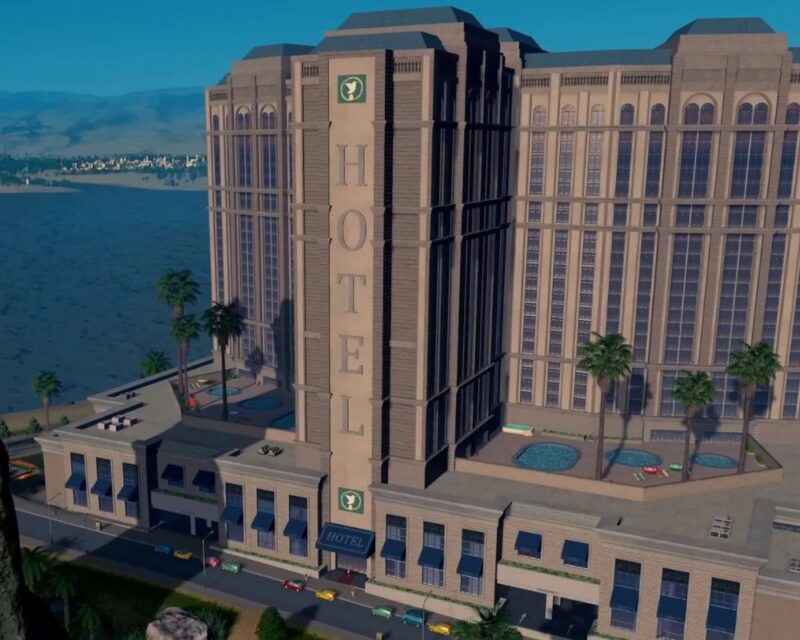 Obrazek przedstawia w pełni monumentalny hotel w śródziemnomorskim klimacie, jaki możemy zbudować dzięki dodatkowi