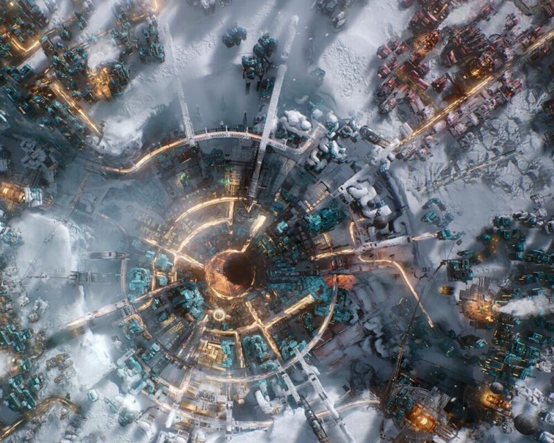 Frostpunk 2 duża, darmowa aktualizacja, na obrazku centrum z generatorem, zimny klimat,. widać parę, budynki oświetlone i rozpalone