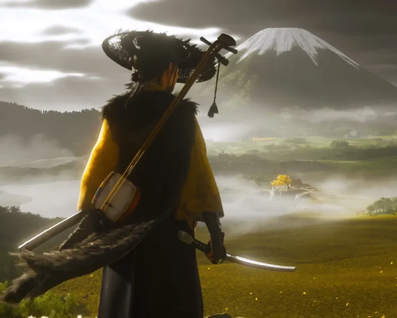 Samuraj w tradycyjnym stroju patrzy na górę Yōtei w Japonii, trzymając katanę i shamisen, w tle widoczna dolina spowita mgłą.